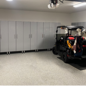 garage with cabinets and golf cart