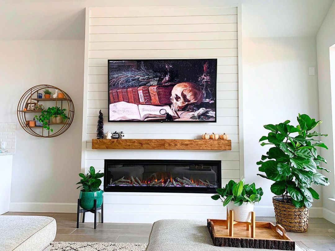 fireplace wall with TV and shiplap finish